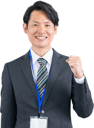 ガッツポーズをするスーツの男性